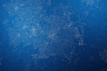 Stylized map of the streets of Birmingham (UK) made with white lines on abstract blue background lit by two lights. Top view. 3d render, illustration