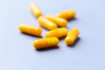 Vitamin C capsules. Bright background. Close up. Copy space.