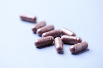 Lutein capsules. Dietary supplement on bright background. Soft focus. Close up. Copy space.