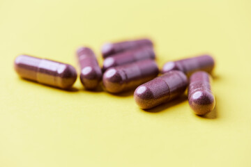 Lutein capsules. Dietary supplement on bright background. Soft focus. Close up. Copy space