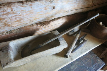 The interior of the hut of the Russian village witch Baba Yaga with skulls, kitchen utensils, dried herbs, stupa and potions