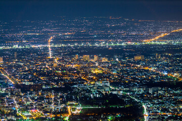 High angle view background from the mountain, showing the lights of apartment buildings, houses,...