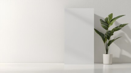 Obraz premium Modern Standee Mockup on Minimalist White Wall with Soft Shadows for Branding Presentation