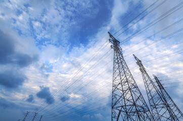 Electricity tower and sky cloudscape at sunset