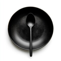 Black empty plate with spoon in a dining setting isolated on white a background