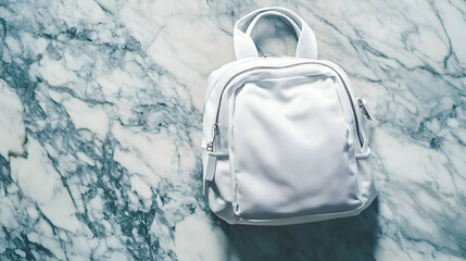 A stylish white backpack placed on a marbled background, offering a sleek and modern look
