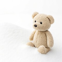 Obraz premium Tiny teddy bear sitting on a soft, plush blanket, with natural light illuminating its fur