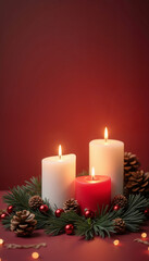 Burning white and red candles surrounded by pinecones and festive decorations on a red background