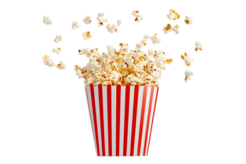 Popcorn flying out of red white striped paper box isolated on white, transparent background, PNG, with copy space. Splash, levitation of popcorn grains.