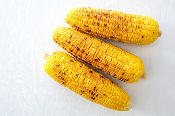 Grilled corn on white background