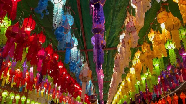 Multi colourful paper lantern light lamps decoration hanging on ceiling in the Yee Peng Festival in Chiang Mai, Northern Thailand