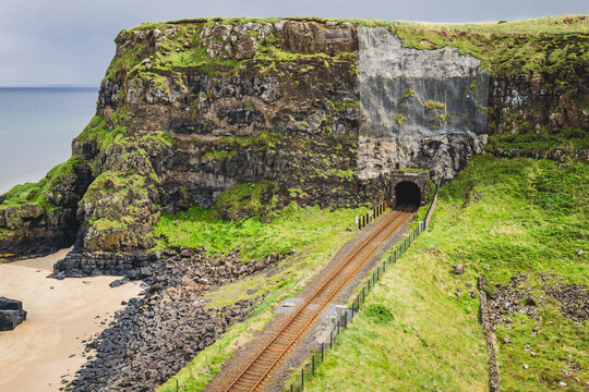 hern Ireland Coastal Railway Tunnel with Cliffside Path