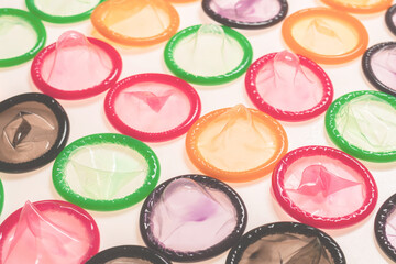 Colorful condoms background.