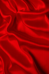 Red silk or satin luxury fabric texture can use as abstract background.