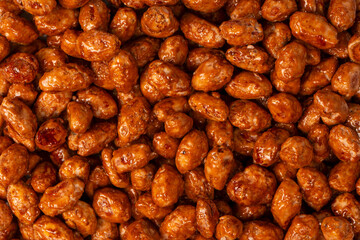 Tasty sweet roasted peanuts as a background.