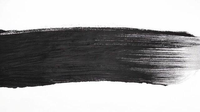 Abstract black brushstroke across a white background, showcasing texture and contrast