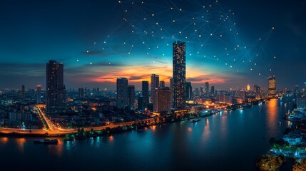 Obraz premium A panoramic view of a modern city at night with illuminated buildings and a river flowing through the cityscape. 