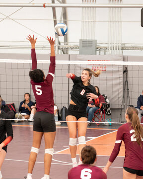 College volleyball player wearing lower back support belt
