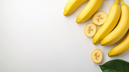 Fresh and Ripe Bananas with Slices Arranged on a Light Background for a Healthy Food Concept and Creative Culinary Use in Various Recipes and Presentations