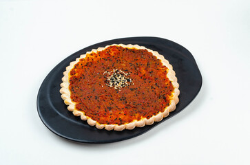 Manakeesh, arabic pizza, flat bread topped with zaatar spices close up. Homemade mediterranean flat bread manakish for breakfast
