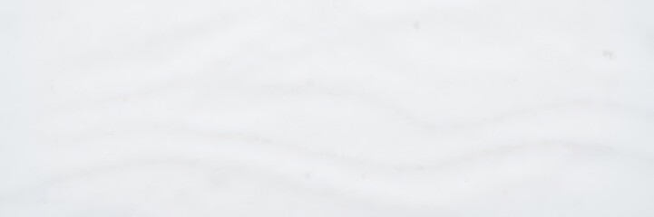 Obraz premium Freshly fallen snow covering the ground, creating a serene white background, pure