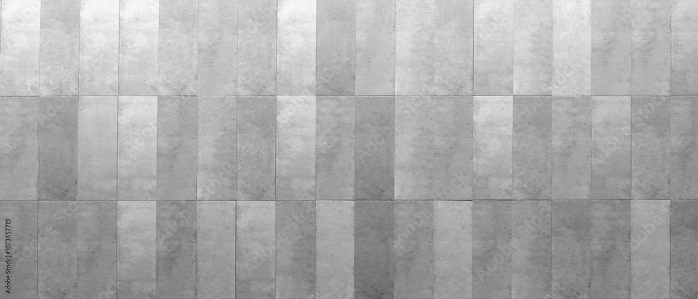 Poster a gray wall with a pattern of squares. the wall is made of concrete and has a very clean, modern loo