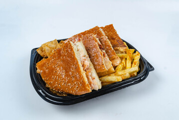 Close up of chicken shawarma meal with lettuce, tomato and onion on white background.
