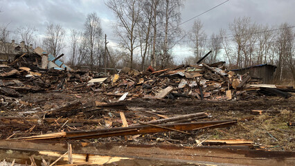 Ruins of a Collapsed Wooden House with Construction Debris and Wreckage, Post-Demolition Scene