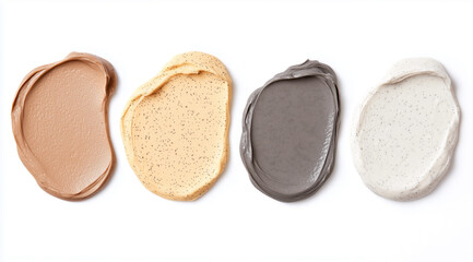 Fototapeta premium Four skincare cream swatches in brown, beige, gray, and white on a white background