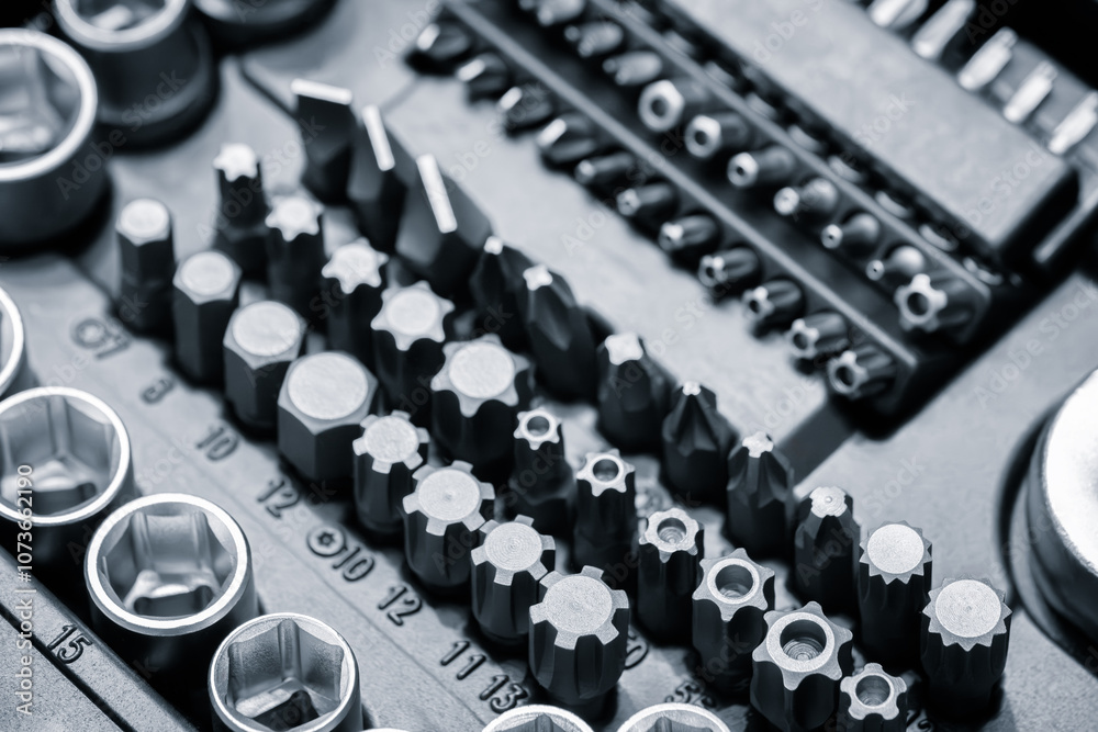 Poster A toolbox with many different sized tools. The toolbox is black and white. The tools are arranged in rows and columns