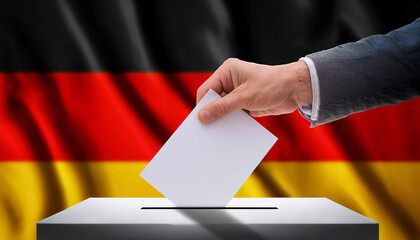 Close-Up of Hand Inserting Ballot with German Flag Blurred in Background