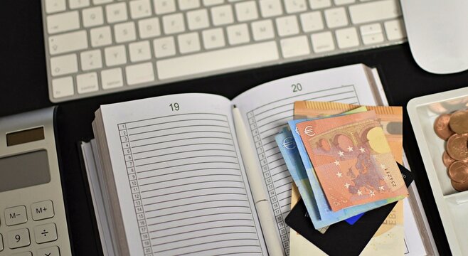 Euro Banknotes, Keyboard, and Calculator on Desk – Financial Concept