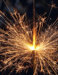 Close-Up of a Sparkler Igniting with Glowing Sparks Flying