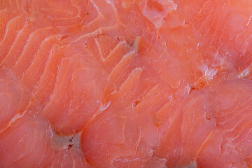 Red salmon fish fillet macro photo as background. Texture of fish fillet.