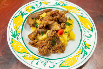 Traditional and rustic Brazilian dish, free-range chicken with polenta. Real food
