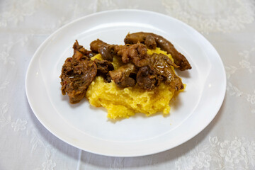 Traditional and rustic Brazilian dish, free-range chicken with polenta. Real food