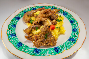 Traditional and rustic Brazilian dish, free-range chicken with polenta. Real food