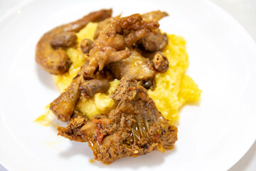 Traditional and rustic Brazilian dish, free-range chicken with polenta. Real food