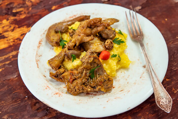 Traditional and rustic Brazilian dish, free-range chicken with polenta. Real food