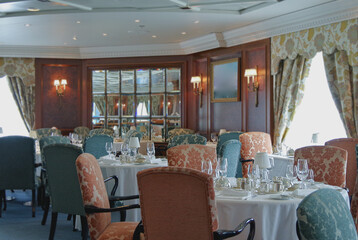 Formal and elegant ocean view dining room restaurant onboard luxury cruiseship or cruise ship liner...