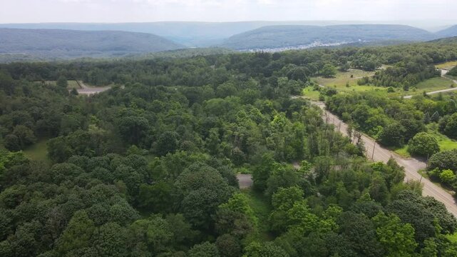 Aerial landscape during summer of green abandoned coal town Centralia Appalachia Pennsylvania