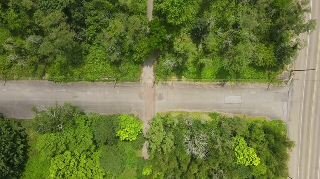 Aerial top down of graffiti road in summer abandoned coal town Centralia Pennsylvania Appalachia