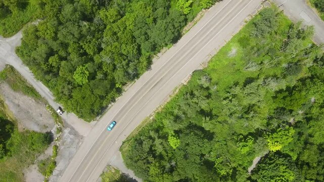 Aerial top down of graffiti road in summer abandoned coal town Centralia Pennsylvania Appalachia