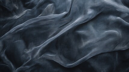 Fototapeta premium Abstract background of a dark gray, draped, sheer fabric.