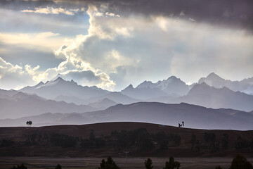 The sun dips below the hills of Chinchero, casting a golden embrace over this sacred land.Nature...