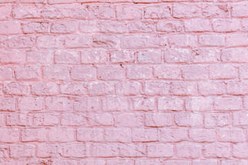 A pink brick wall with a white brick border