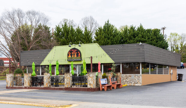 VALDESE, NC, USA-24 MARCH 2022: Los Compadres Mexican Restaurant, on Main Street, with colorful outdoor dining.