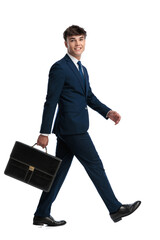 young businessman in navy blue suit walking with confidence