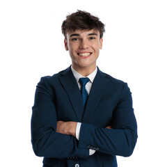 enthusiastic young businessman in his 20s crossing arms and smiling