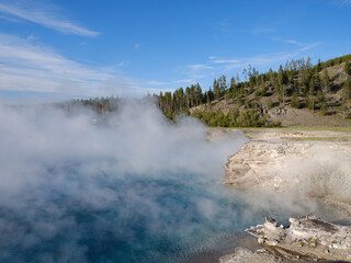 Steam rises from the Excelsior Geyser within Yellowstone Park in Montana